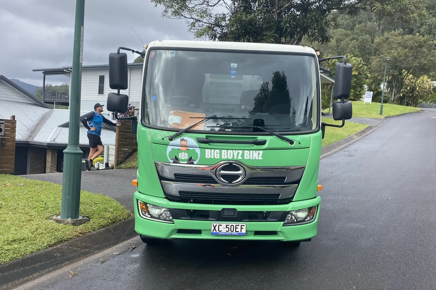 Big Boyz Binz truck head-on in a Cairns street on a wet day