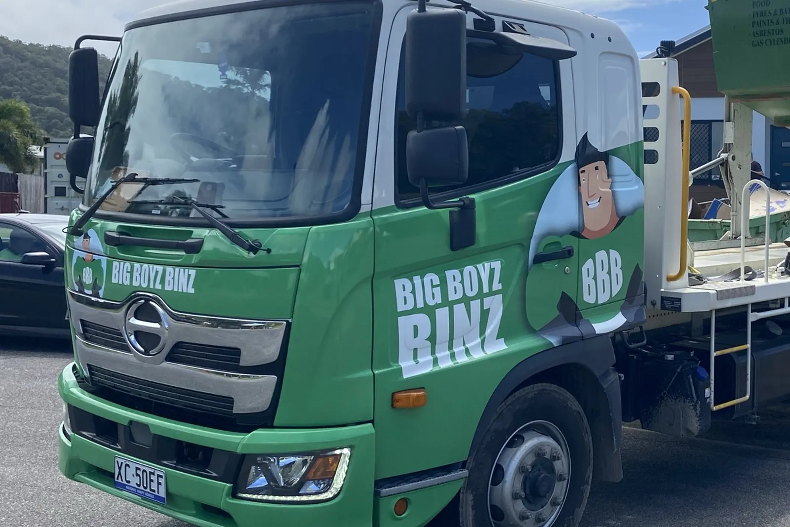 The Big Boyz Binz truck cab, green with the brand on the door, at the Holloways Beach yard